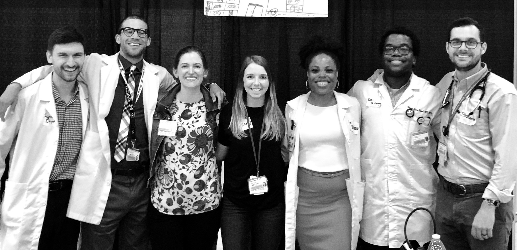 group photo of medical personnel wearing white coats